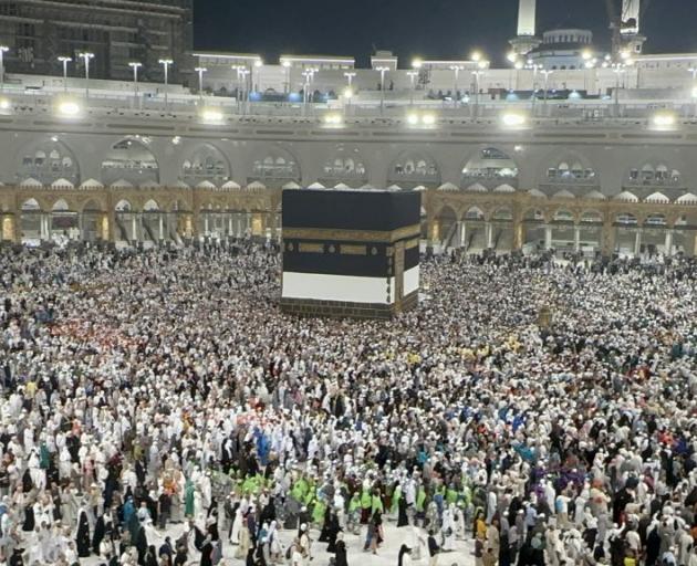 Pilgrims worship and circumambulate around the Kaaba after fulfilling the Hajj pilgrimage in...