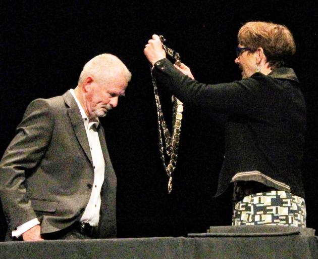 Invercargill Mayor Nobby Clark receives the mayoral chains from Invercargill city council chief...