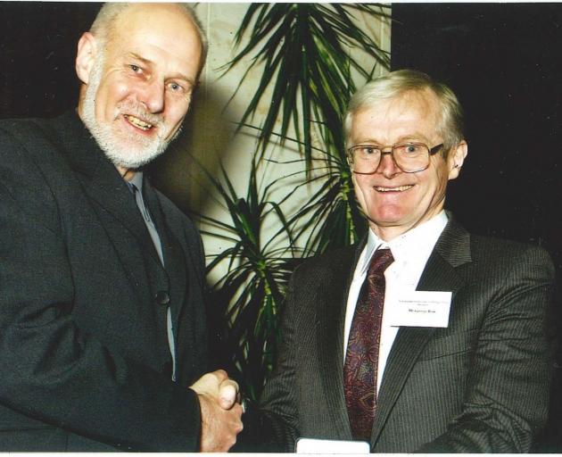 George Risk (right) receives his Royal Society and Technology Medal from then Minister of...