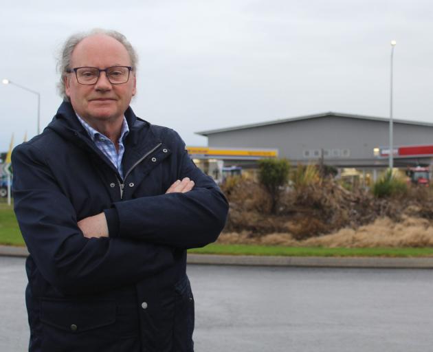 Invercargill deputy mayor Tom Campbell standing in front of the North Rd roundabout, which drew...