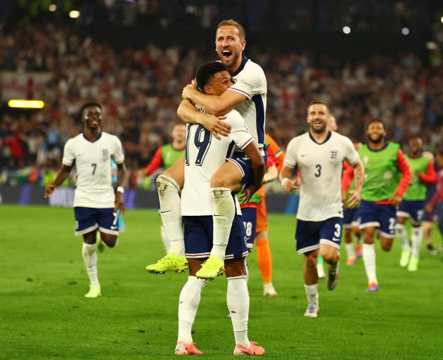 England's Harry Kane celebrates with Ollie Watkins after winning the match. Photo: Reuters