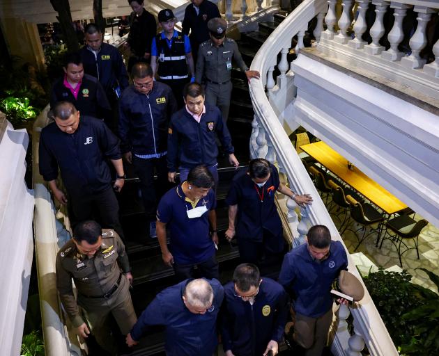 Central Investigation Bureau (CIB) officials visit the Grand Hyatt Erawan Hotel after the deaths....