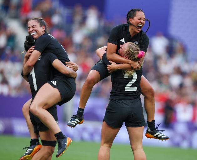 The Black Ferns celebrate their tight win over Canada in the Olympic final in Paris. Photo: Reuters