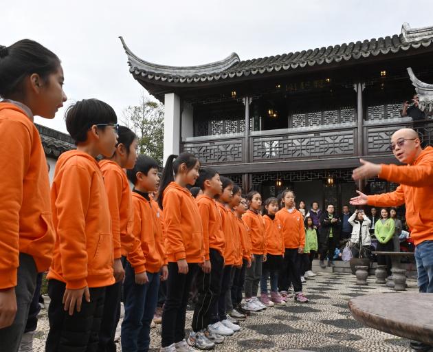 Conductor Shuyang Deng directs the Shanghai Oriental Art Centre children’s choir performance at...