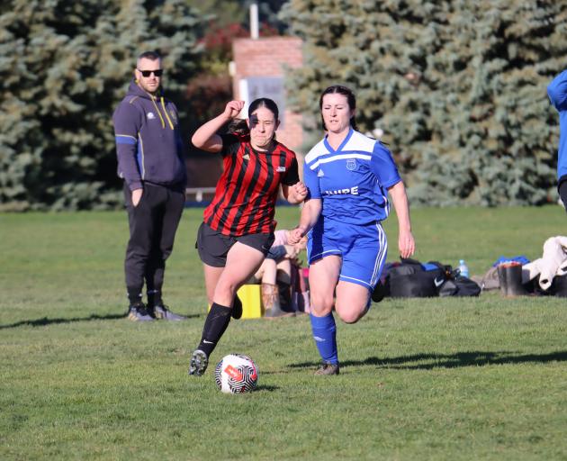 Gore Wanderers player Amiera Kortbaoui runs the ball down the wing as a Thistle player chases her...