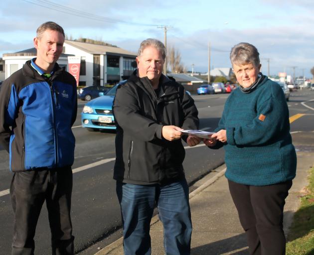 Invercargill residents Karl Herman and Barb Walker deliver the petition to NZTA Southland highway...