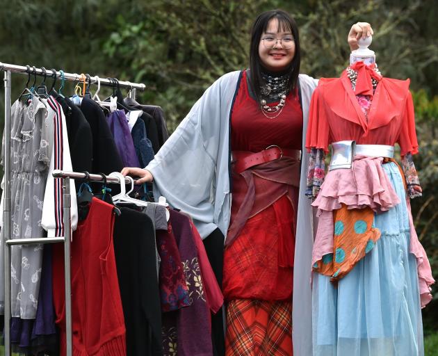 Trinity Catholic College student Vania Wong, 16, showcases a rack of second-hand and upcycled...