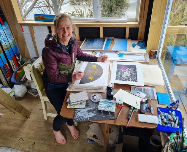 Albert Town artist Chrissy Wickes prepares art for her upcoming talk and exhibition on the...