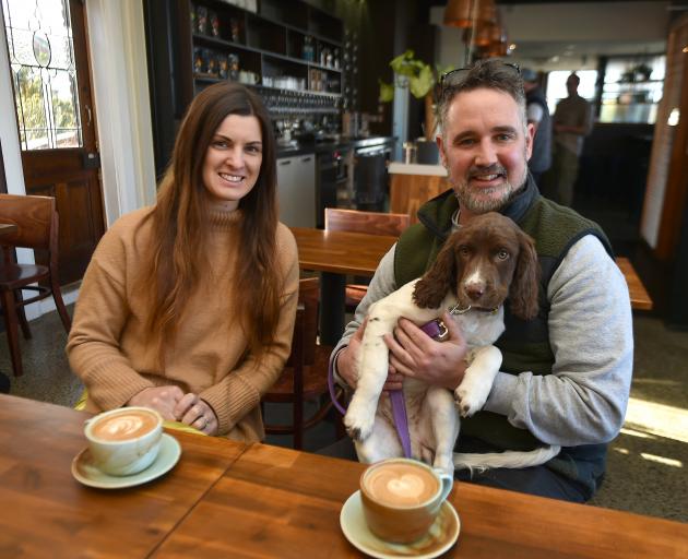 Copper on Highgate owners Morgie and Johno Lyons enjoy a coffee with their 14-week-old springer...