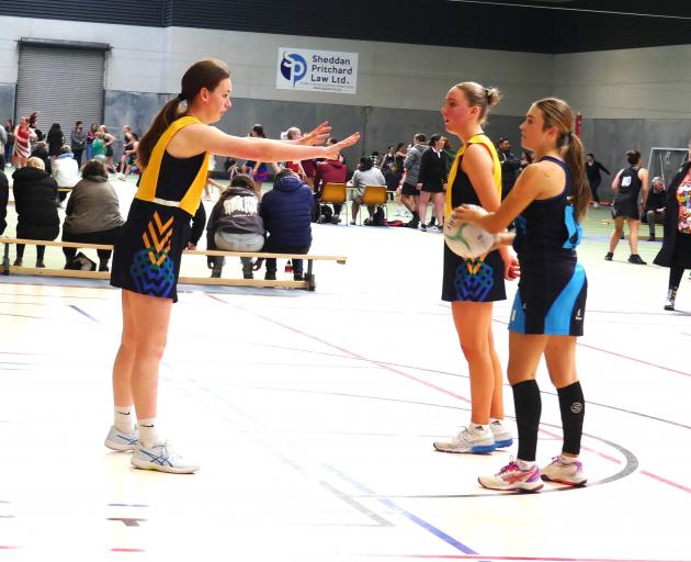 Maruawai A player Layla Connorton attempts to block the penalty pass awarded to Blue Mountain...