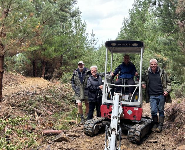 Checking out the progress being made on the stage two loop track are Waikaia Trails Trust members...