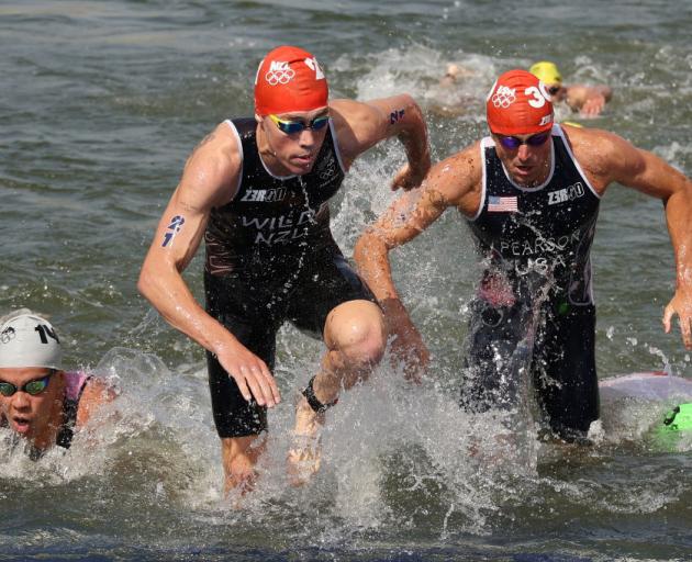 New Zealander Hayden Wilde (centre) competing in the men's individual triathlon last week. Photo:...