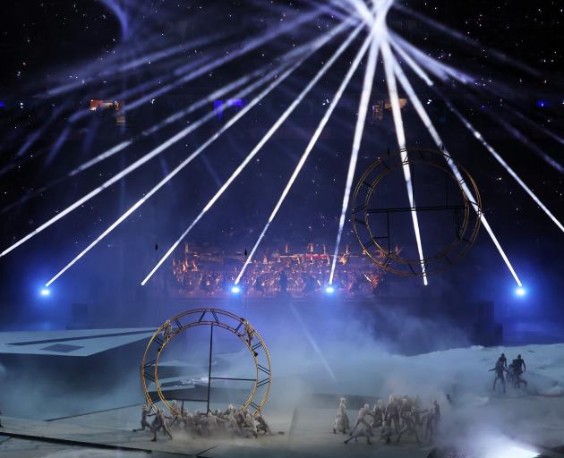 Performers assemble the Olympic Rings during the show. Photo: Getty Images