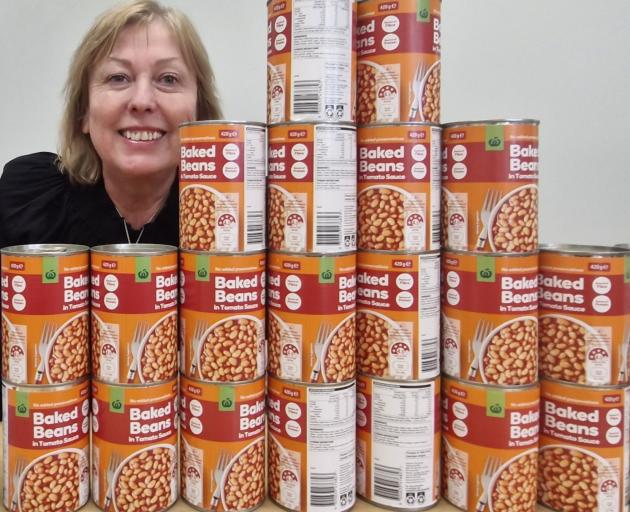 Tracey McLellan received 23 cans of baked beans as part of a food drive for the Linwood Avenue...