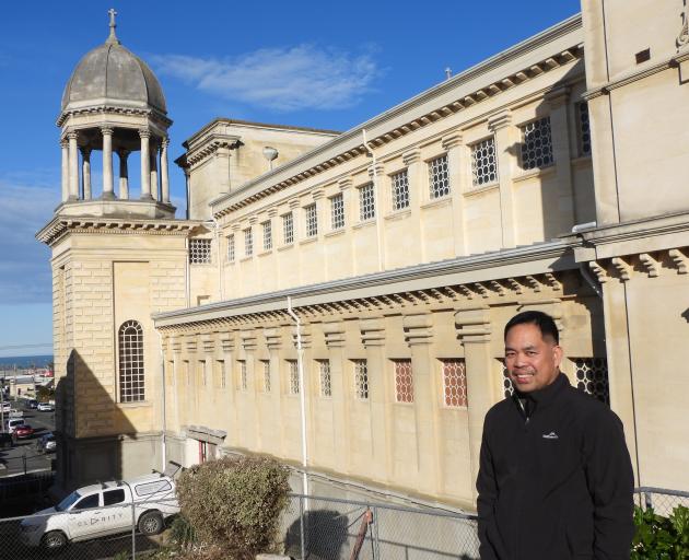 Fr Fredy Permentilla stands alongside St Patrick’s Basilica, in Oamaru, where a $1.4million...