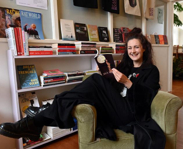 Small Press Fest curator Frances Pavletich reads an issue of Awa Wahine at Evening Books. PHOTO:...