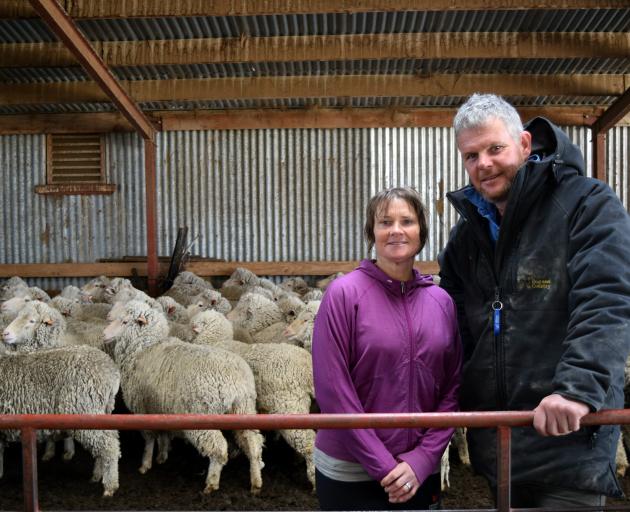 Goulburn Station owners Allan and Karleigh Small and some of their mixed age quarterbred ewes set...