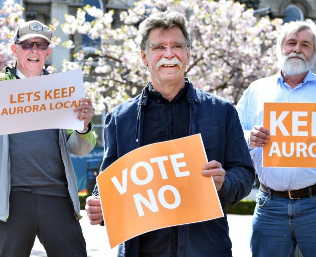 Pleased with the Dunedin City Council’s decision to retain Aurora Energy are (from left) Mike...