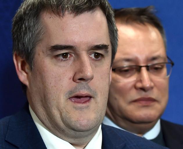 Infrastructure Minister Chris Bishop (left) and Health Minister Dr Shane Reti speak to media at...