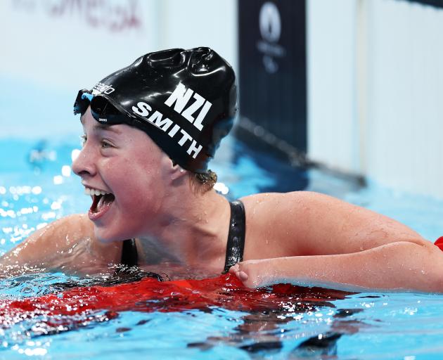 New Zealand swimmer Cameron Leslie salutes after finishing fourth in the final of the men’s 50m...