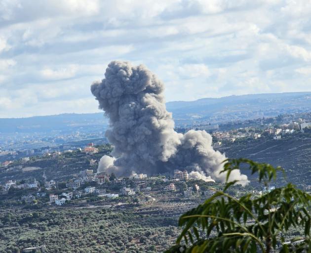Smoke rises after an Israeli airstrike hit the ancient city of Tyre, in southern Lebanon. Photo:...