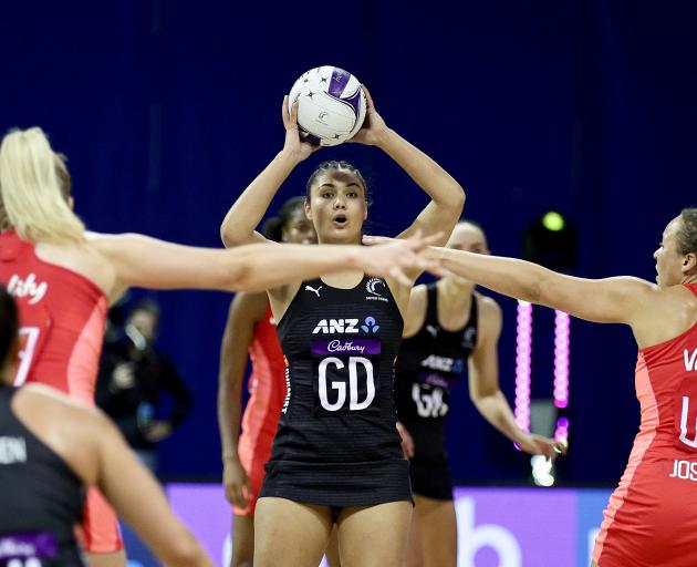 Parris Mason of the Silver Ferns holds the ball.