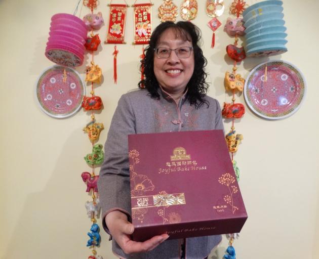 Oamaru Chinese Association president Janice Burnett presents mooncakes as a traditional food of...
