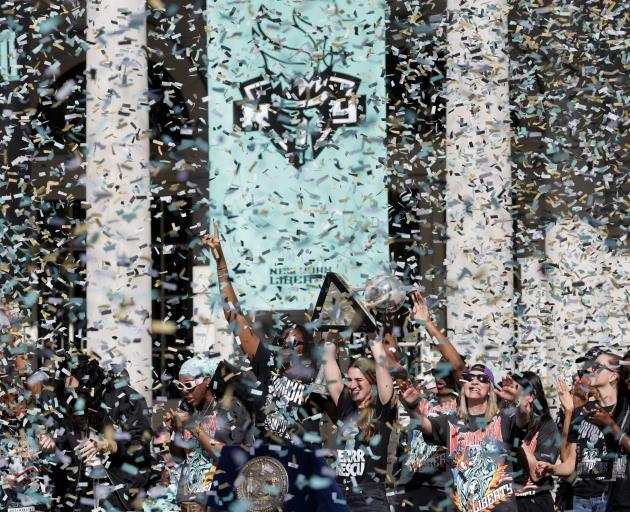 ConfettiI falls as the New York Liberty celebrate during the WNBA championship title ceremony in...