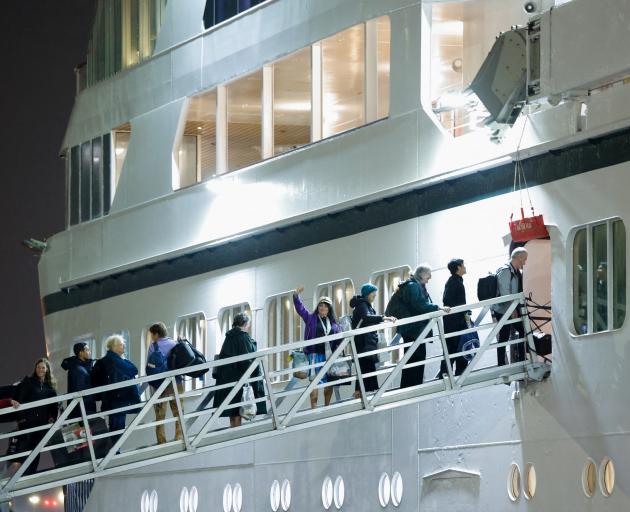 Passengers board Villa Vie Residences’ cruise ship Odyssey in Belfast. PHOTO: REUTERS