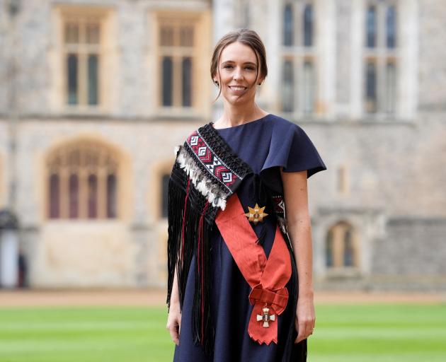 Dame Jacinda Ardern, wearing a traditional Kakahu cloak, after being made a Dame Grand Commander...