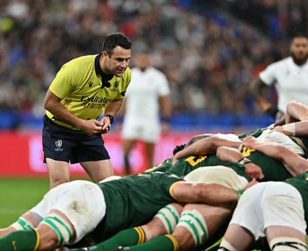 Ben O'Keeffe watches the scrum during the 2023 Rugby World Cup semi-final between England and...