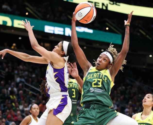 Jordan Horston (right) grabs a rebound while playing for the Seattle Storm against the Los...