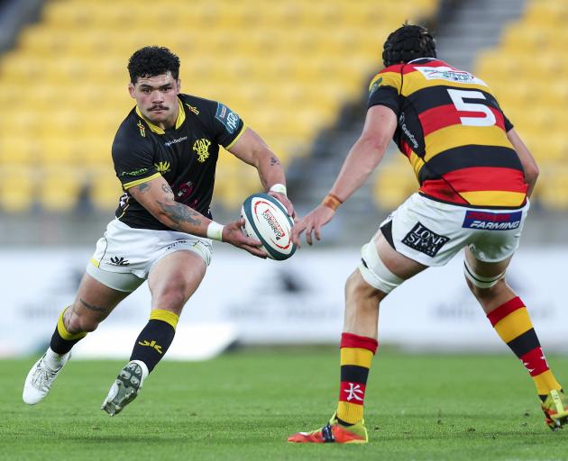 Wellington flanker Du’Plessis Kirifi goes on the attack against Waikato lock Josh Balme during...