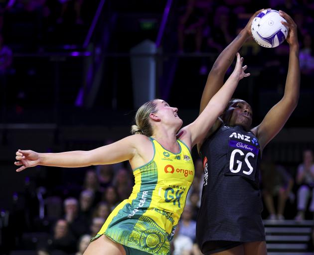 Grace Nweke of New Zealand and Courtney Bruce of Australia compete for the ball during game one...