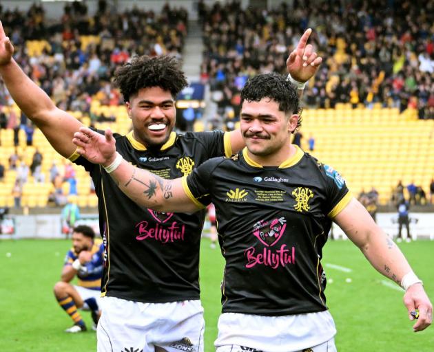 Wellington loose forwards Sione Halalilo (left) and Du Plessis Kirifi celebrate after their win...