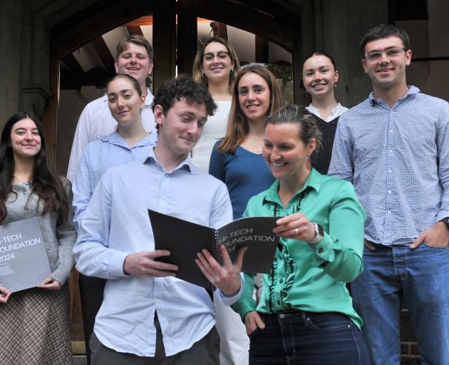 Ben Gillespie (centre front) discusses a report for the Hi-Tech Trust with trustee Sarah Ramsay...