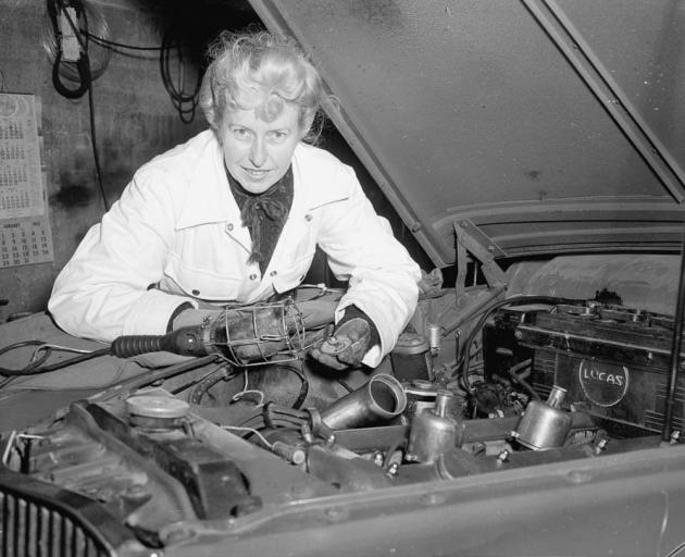 Sybil Lupp tinkers under the hood to squeeze a bit more horse power out of the engine. PHOTO:...