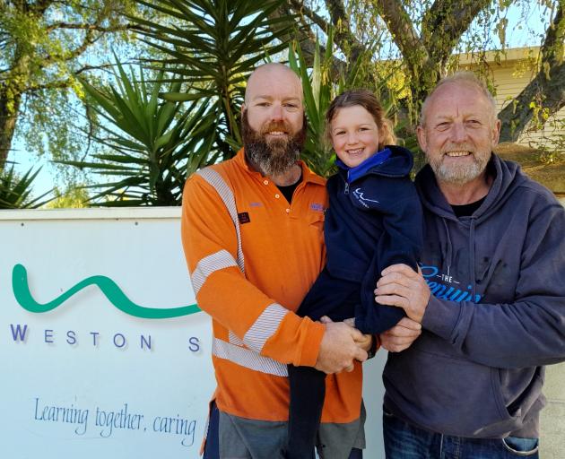 Riley Clark was accompanied by her father, Lance (left), and grandfather Steve, PHOTO: JULES CHIN