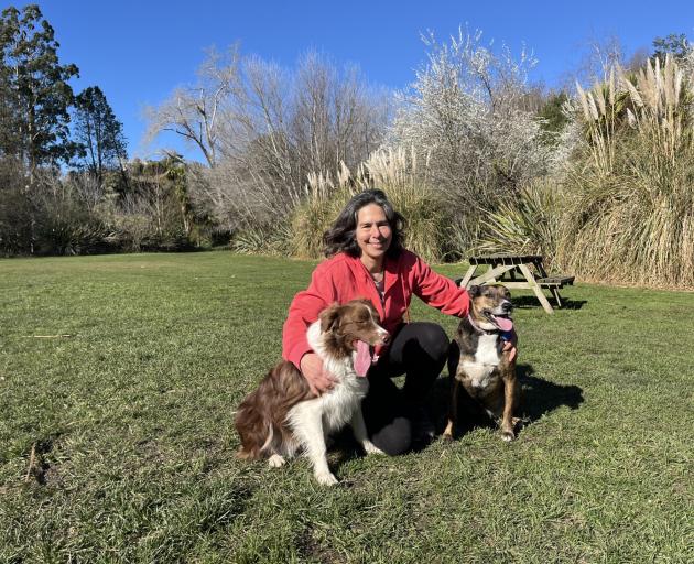Michelle Hahn with two dogs she trained, Rosie (left) and Korra. PHOTO: NIC DUFF