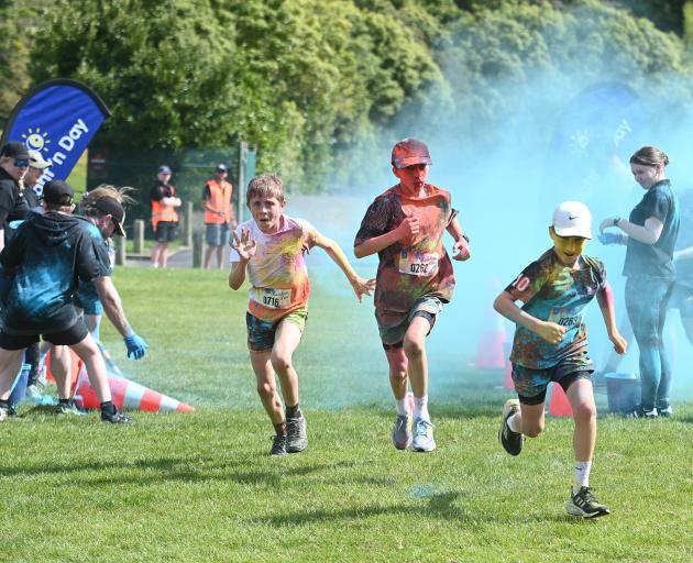 The trio approach the finish line.