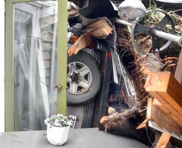 A large slip in Maia forced a local family’s Land Cruiser into their dining room. PHOTOS: STEPHEN...