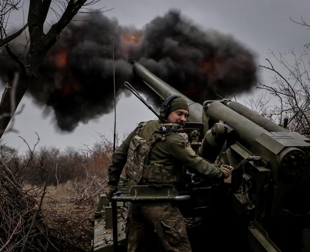 A Ukrainian Armed Forces 24th Mechanised Brigade serviceman fires a "Hyacinth-s" self-propelled...