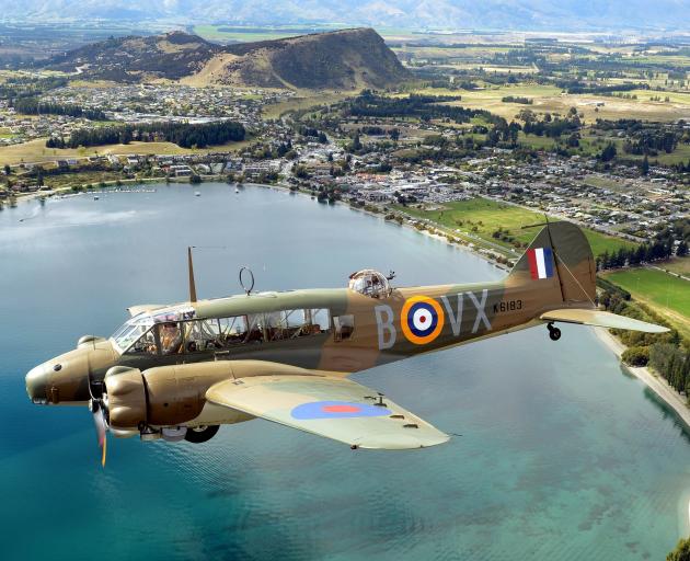 The only airworthy Avro Anson MK1 in the world flies over Lake Wānaka with Bill Reid and Dave...