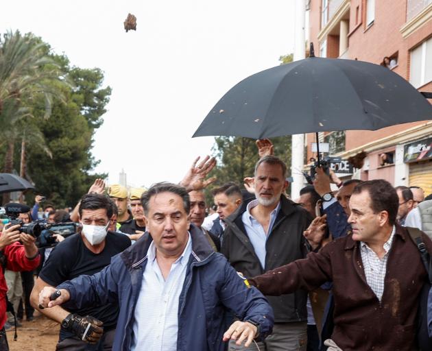 Mud was thrown at King Felipe during his visit to Paiporta on Sunday. Photo: Reuters