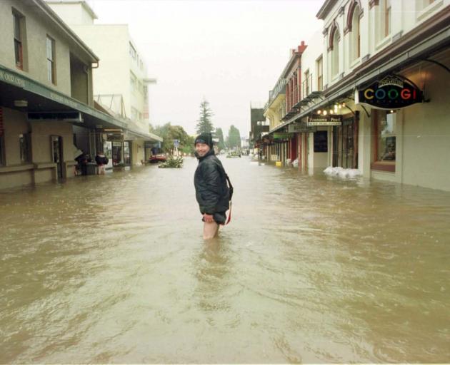 Queenstown’s Alec McGregor pictured in Beach St during the 1999 flood. PHOTO: ARCHIVE