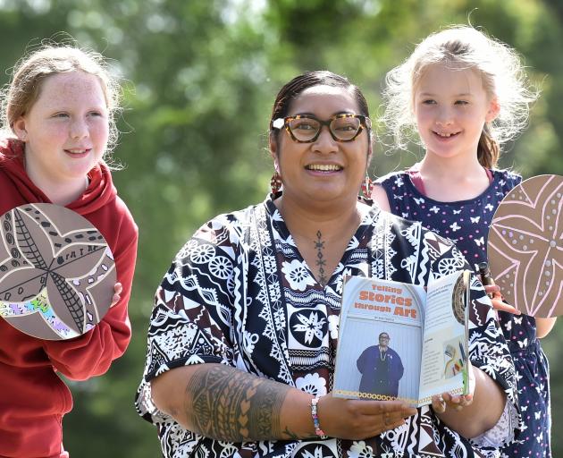 Dunedin artist Ana Teofilo displays the New Zealand School Journal she features in while Halfway...
