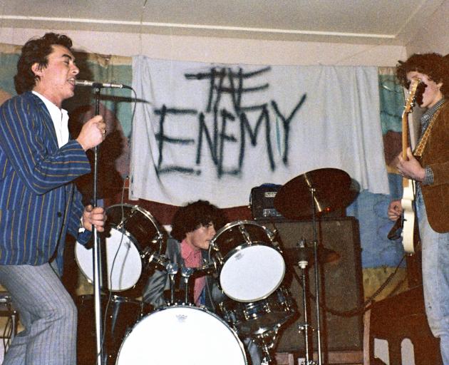 Doug Hood (left) on vocals at The Clean’s first gig at Beneficiaries Hall, Dunedin, supporting...