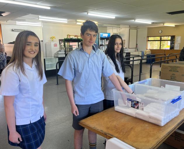 Māruawai College students (from left) Shay Reid, Bryon McClintock and Savannah Vensson tuck into...