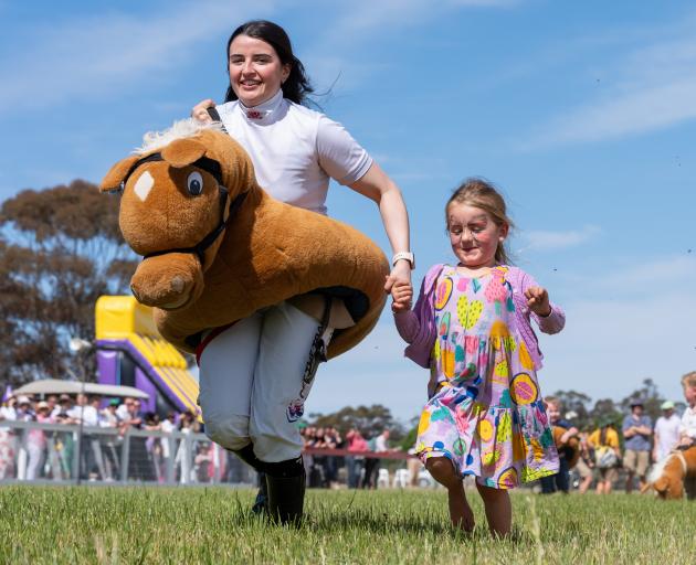 Former Wingatui jockey Jaylah Kennedy joins in the fun with youngsters at a race meeting in St...