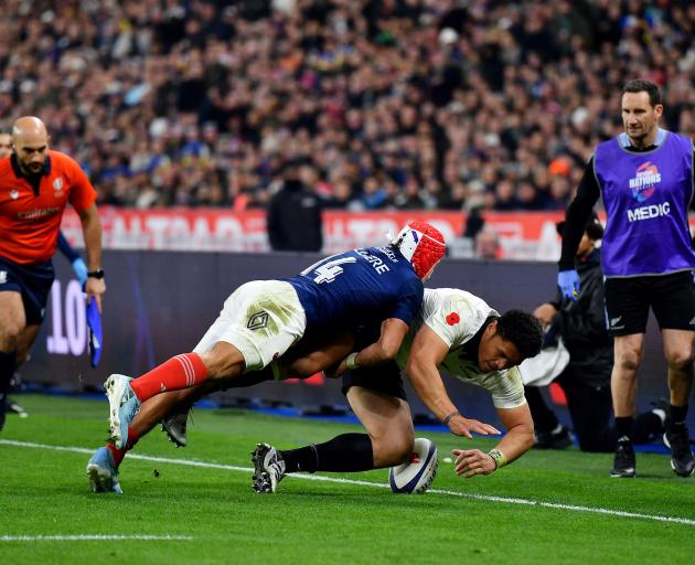 Caleb Clarke is bundled into touch by Gabin Villiere of France. Photo: Getty Images